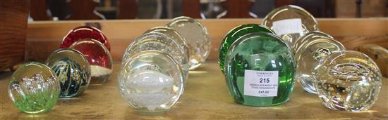 Green glass weight and other paperweights